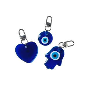 Blue resin Evil Eye keychain set with Hamsa Hand and heart pendants on white background