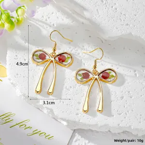 Detailed view of bow earrings with real dried flower resin inlay and size dimensions