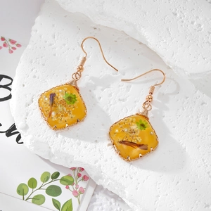 Square yellow resin earrings with white dried flowers and gold stainless steel hooks