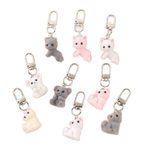 Set of 9 cute flocked animal keychains in assorted colors with durable silver metal clips