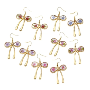 Elegant gold-plated bow earrings with colorful dried flowers in five vibrant shades