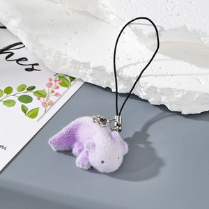 Detail of purple flocked axolotl keychain with soft texture and sturdy black lanyard strap