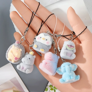 Cute flocked resin animal keychains featuring blue elephant and gray penguin pendants