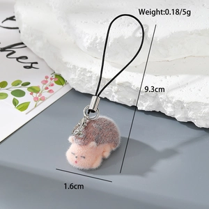 Detail view of pink flocked hedgehog keychain showing 9.3cm length and lobster clasp