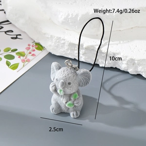 Detail shot showing 7.4g weight and 10cm height of the grey koala flocked keychain