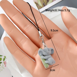 Detailed view of flocked koala charm with dimensions 9.5cm length and 3.7g weight