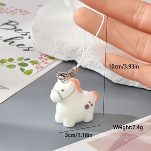Miniature white flocked resin pony charm with orange hair and detailed size measurements