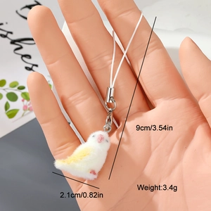 Detail view of mini plush bird charm showing 9cm length with silver lobster clasp and strap