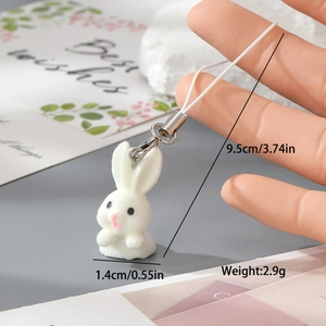 Detail showing dimensions of white flocked rabbit keychain charm with 1.4cm width and 9.5cm length