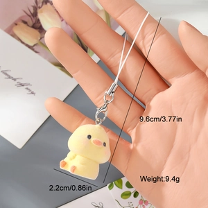 Detail shot of mini yellow flocked chick pendant with dimensions 9.6cm and metal clasp