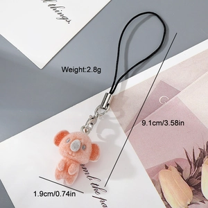 Detail showing pink koala plush keychain dimensions and weight for mobile accessories