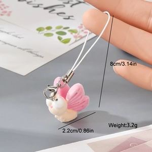 Detail showing the 8cm cord and pink resin butterfly charm on a white phone lanyard