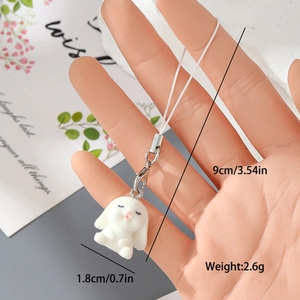 Detail showing miniature 1.8cm white flocked rabbit charm with lobster clasp and phone strap