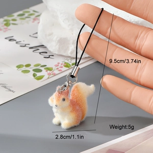 Detail view of mini orange flocked squirrel charm with dimensions and metal clip