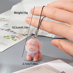 Porte-clés chiot floqué rose montrant les dimensions 10,5 cm de long et 10 g de poids