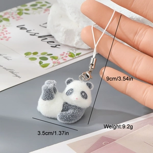 Detail showing dimensions of a flocked panda charm with white strap and silver clasp