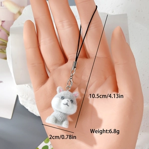 Détail du porte-clés chiot floqué montrant la longueur de 10,5 cm et le poids 6,8 g