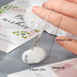 Detail of white flocked resin seal keychain showing 3.5cm size and soft plush texture