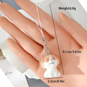 Détail du porte-clés chiot en peluche pesant 6.8g et mesurant 9.7x2.3cm
