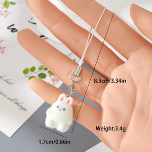 Close-up of mini white flocked rabbit charm with dimensions 1.7cm and weight 3.4g