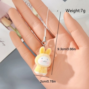 Detailed view of yellow flocked bunny keychain showing dimensions of 9.3cm x 2cm