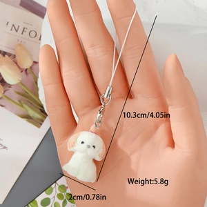 Detailed view of white flocked dog keychain with size specs 10.3cm height and 5.8g weight