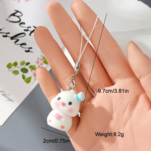 Close-up showing the soft flocked texture and exact dimensions of the cute animal keychain
