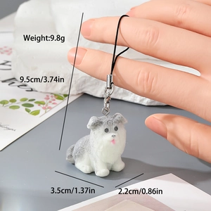 Détail d'un porte-clés chiot en résine floquée grise avec dimensions 9,5cm et poids de 9,8g