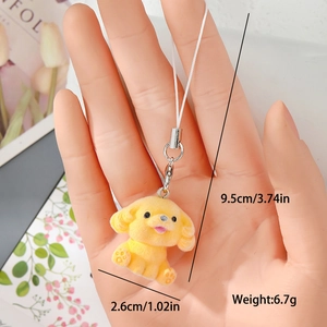 Detailed view of yellow flocked teddy dog charm showing 2.6cm height dimensions