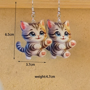 Detail view of acrylic kitten earrings with 6.5cm height and 3.7cm width dimensions
