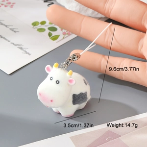 Mignon pendentif vache en résine floquée avec taches noires pour sacs ou clés