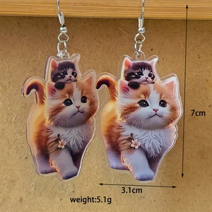 Detailed view of cute cat acrylic drop earrings measuring 7cm in height and 3.1cm in width