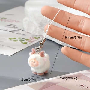 Detail showing the white sheep keychain dimensions of 9.4cm length and 6.7g weight