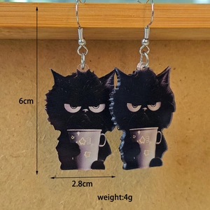 Detail view of funny black cat acrylic drop earrings with 6cm height and 4g weight