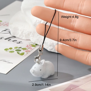 Detail view of a mini flocked hamster keychain with dimension markings and lobster clasp