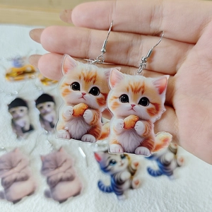 Cute acrylic orange cat earrings featuring double-sided prints and silver hooks for women