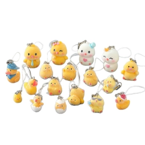 Cute collection of flocked resin yellow duck and chick keychains with various cartoon designs