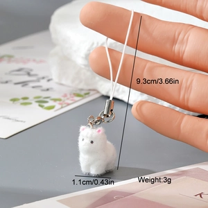 Detail shot of a white flocked cat keychain with dimensions 9.3cm length and 3g weight