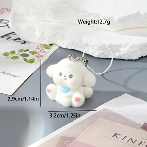 Cute white flocked resin dog keychain with pink paw prints and blue charm for bags