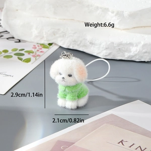 Detail showing white plush puppy dog charm wearing a green sweater with size measurements