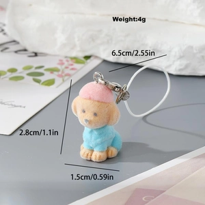 Detailed macro view showing the size dimensions and pink velvet puppy keychain charm