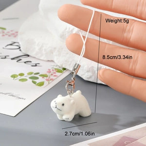 Detail view of cute white flocked polar bear keychain with dimensions and metal clip