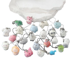 Cute flocked animal keychains in pastel colors featuring polar bear and penguin charms