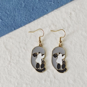Detailed macro view of enamel animal sea lion earrings with premium gold stainless steel hooks
