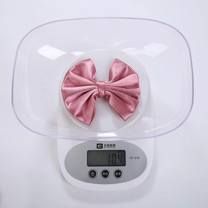 Pink satin bow hair clip for girls, handcrafted fabric accessory weighing 10.4g