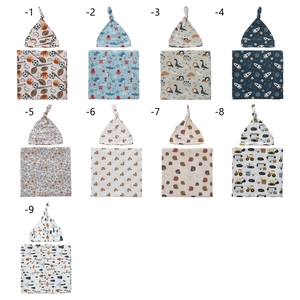 Set of 9 printed baby swaddle blankets with matching top knot hats in various cute patterns