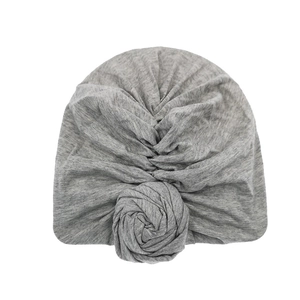 Detailed view of grey soft cotton baby turban hat featuring a 3D rose knot decoration