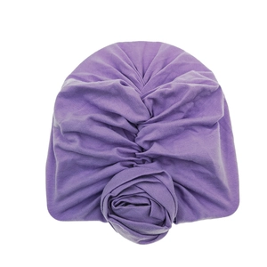 Soft purple cotton baby turban hat with a twisted front knot on white background