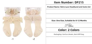 Detailed view of baby headband flower and ribbed cotton socks with velvet bow decoration
