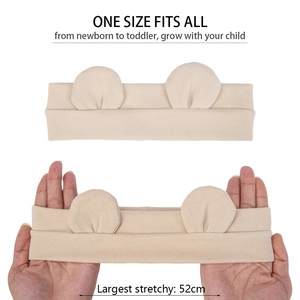 Detail of stretchy beige baby headband with cute bear ears and high elasticity demo
